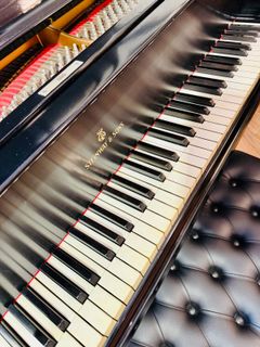 Piano being prepared for sale at The Piano Guyz